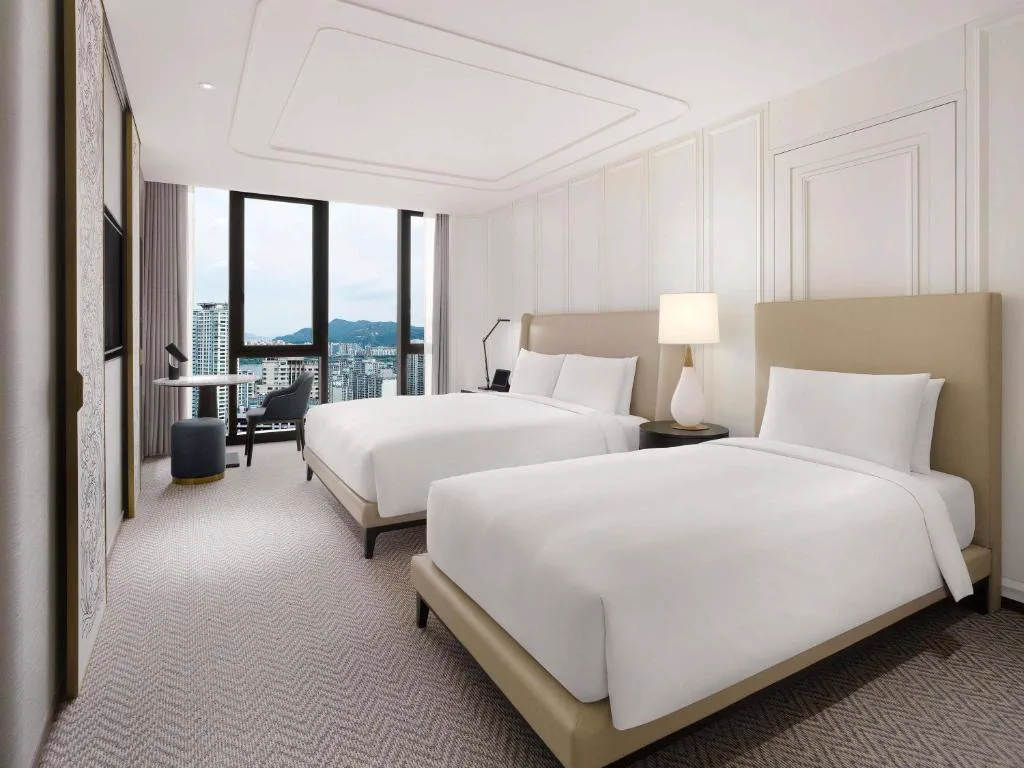 Guest room and sitting area at Sofitel Ambassador Seoul