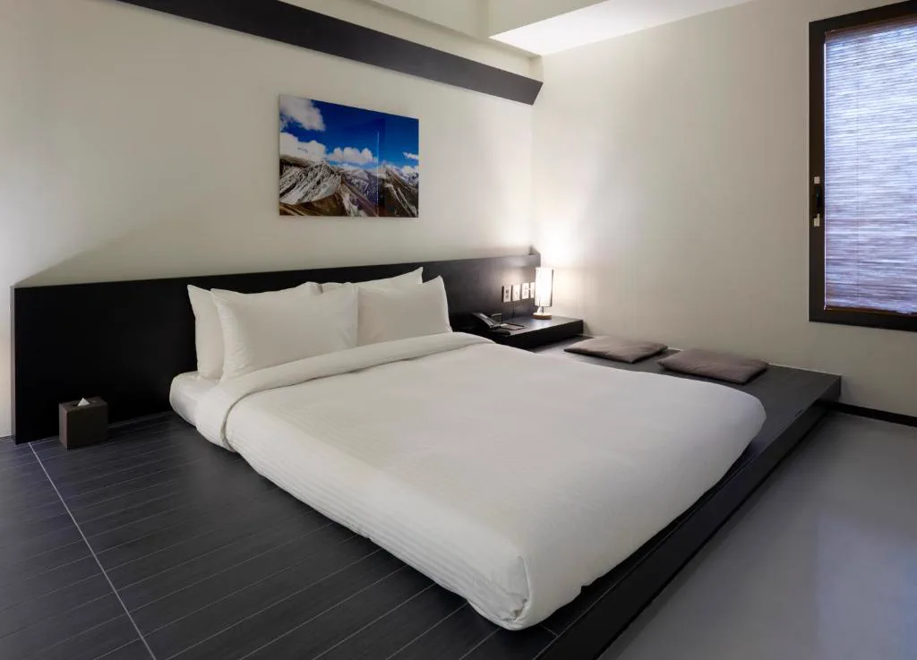 Guest room bed at Sotetsu The Splaisir Seoul Myeongdong