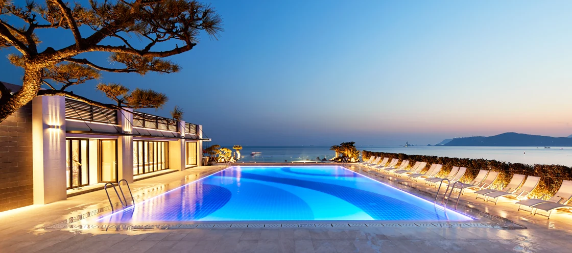 Paradise Hotel Busan — Outdoor Ocean Spa Pool, ocean-view at dusk (official real photos)